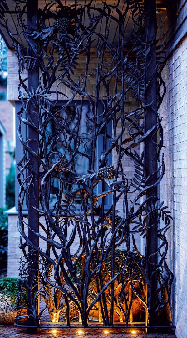 Forged metal, coated with hot zinc, painted.
