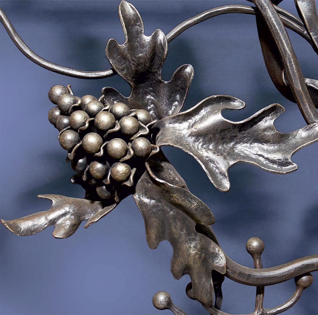 Forged metal, coated with hot zinc, painted.