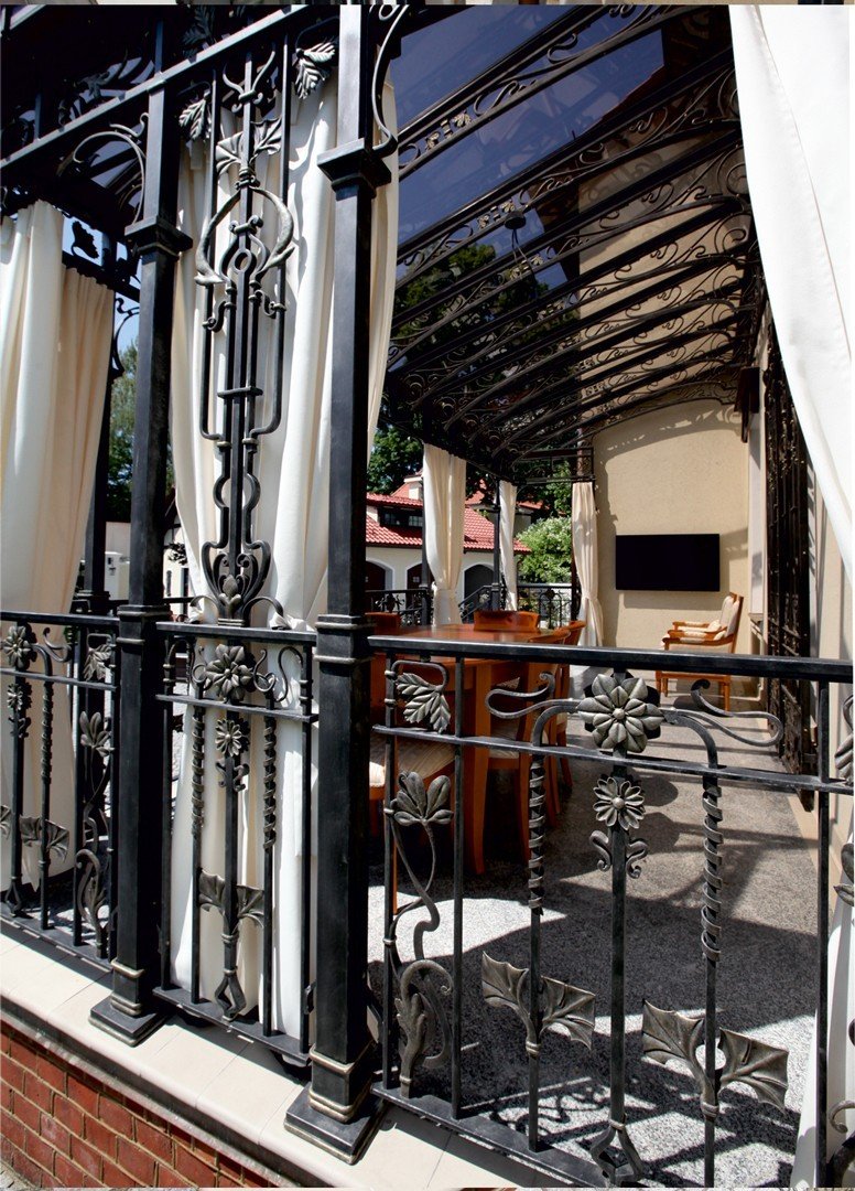 Forged metal, coated with hot zinc, painted