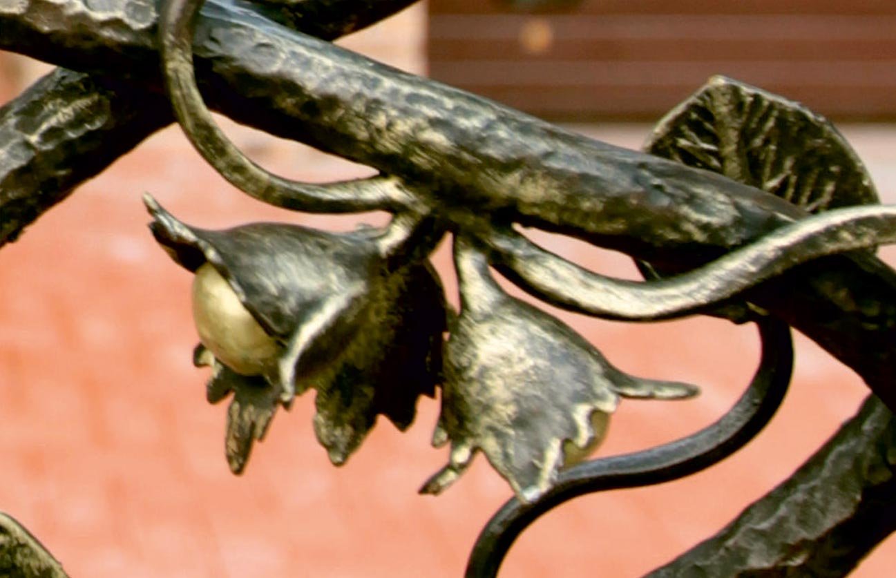 Forged metal, coated with hot zinc, painted