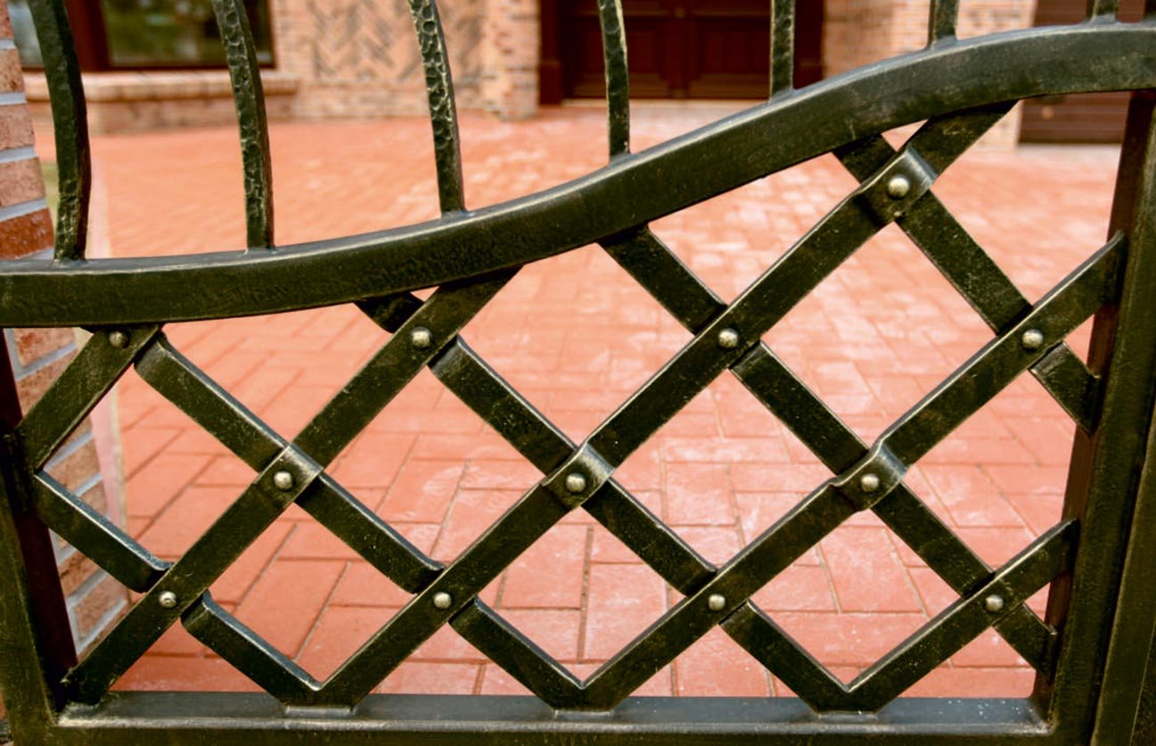 Forged metal, coated with hot zinc, painted
